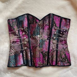 NWOT Steampunk overbust corset with silver front clasp hardware and chains.